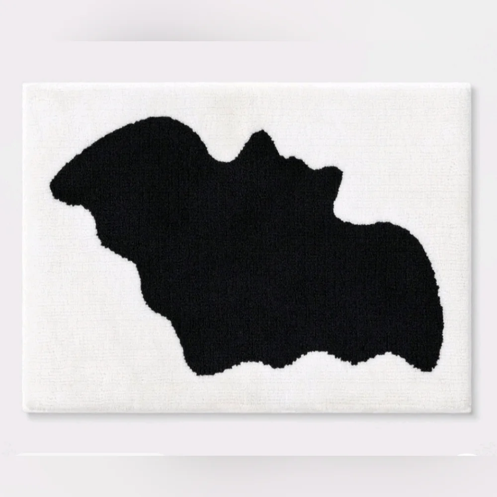 New Hyde and eek Halloween cream color Bath Rug with a black bat print